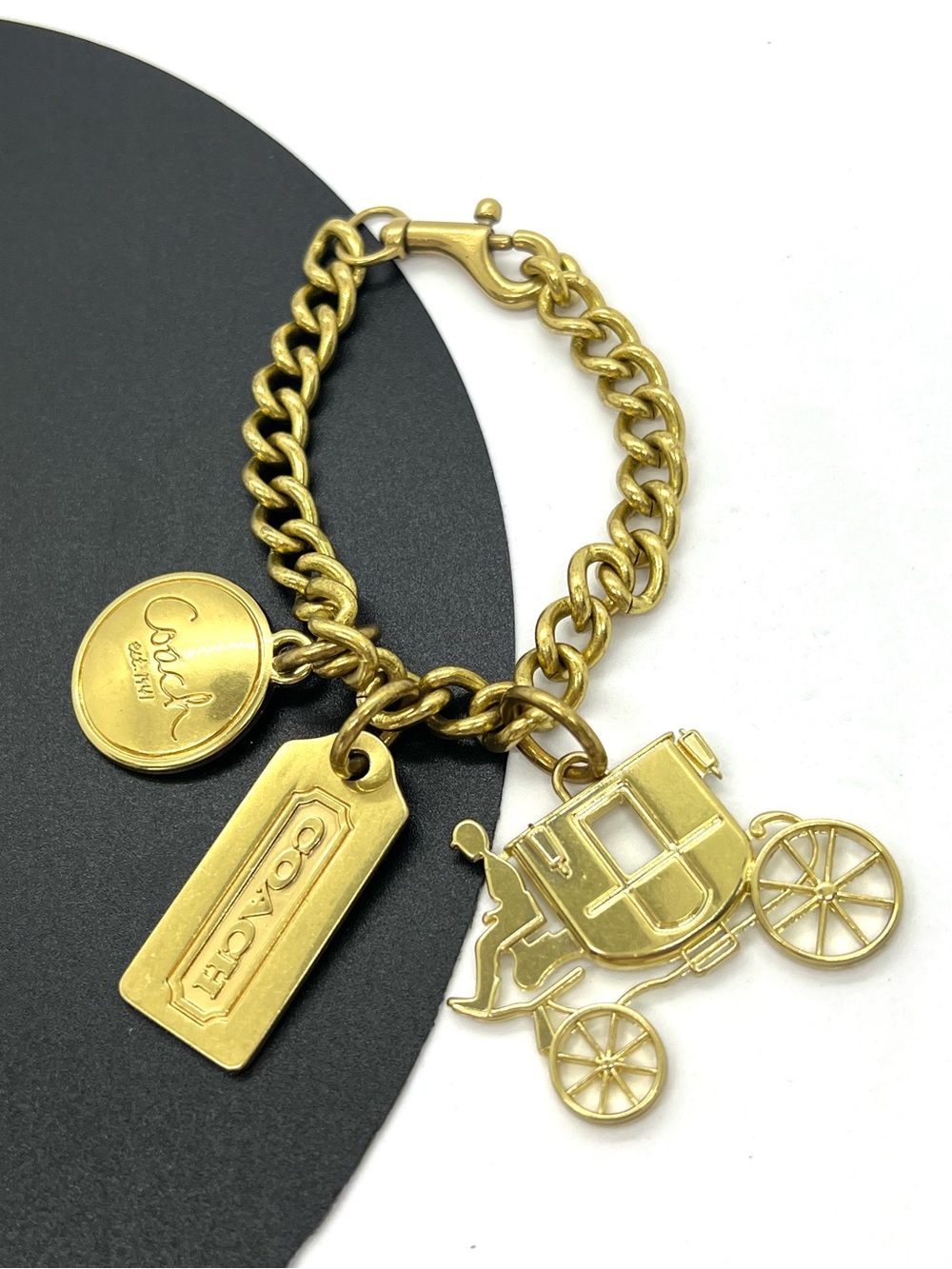 Coach Gold Tone Charm Bracelet with Carriage Charms